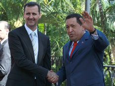הוגו צ'אבס והחבר בשאר אסד (צילום: AP)