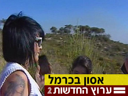 כבאי מדבר עם משפחתו מתוך האש (צילום: חדשות 2)