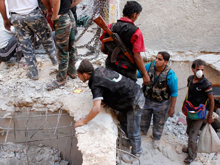 הריסות בסוריה אחרי הפצצה, הפעולה תידחה? (צילום: רויטרס)