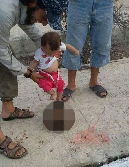 אב ותינוק דאעש (צילום: טוויטר)