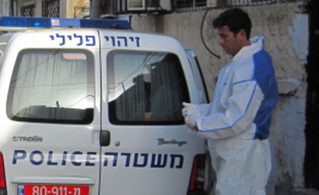 חוקר מז"פ בפעולה (צילום: משטרת ישראל)
