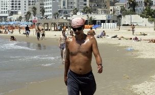 גבר ישראלי בחוף הים (צילום: Christopher Furlong, GettyImages IL)