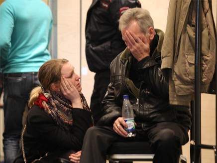 משפחות הנספים ממתינות לתשובות (צילום: Igor Russak / RIA Novosti)