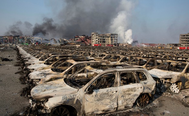 13.8 גרוטאות לאחר פיצוץ בסין (צילום: Sakchai Lalit | AP)