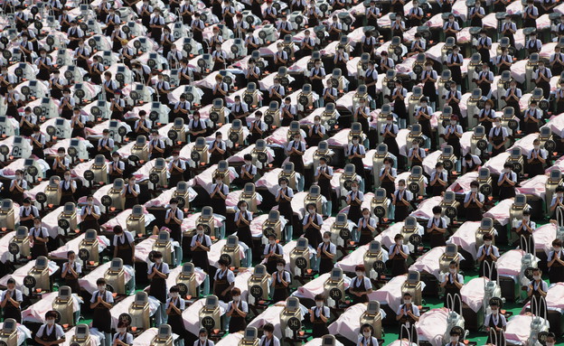 4.5 שיא גינס בלבישת מסכות סינון אוויר ביפן (צילום: VCG, GettyImages IL)