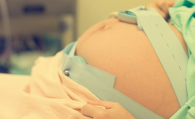 אישה בחדר לידה, אילוסטרציה. (צילום: Shutterstock)
