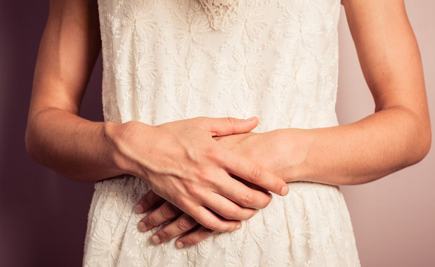 ידיים על בטן הריונית (צילום: Lolostock, Shutterstock)