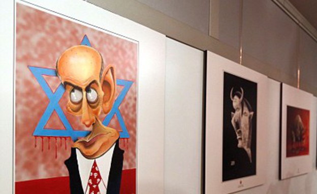 תערוכת קריקטורות על השואה באיראן (צילום: ATTA KENARE, GettyImages IL)