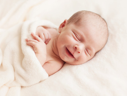 תינוק מחייך (צילום: Shutterstock)