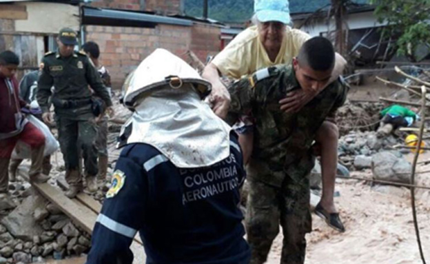 כוחות החילוץ פועלים בקולומביה. היום (צילום: Sky News)