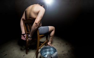 אסיר כלוא (צילום: ShutterStock)