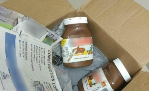 הסמים הוסלקו בחבילות שוקולד למריחה (צילום: דוברות המשטרה)