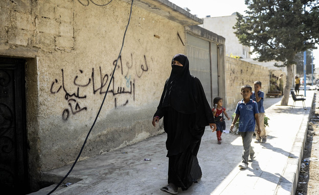 אישה וילדים בסוריה (צילום: Defne Karadeniz, gettyimages)