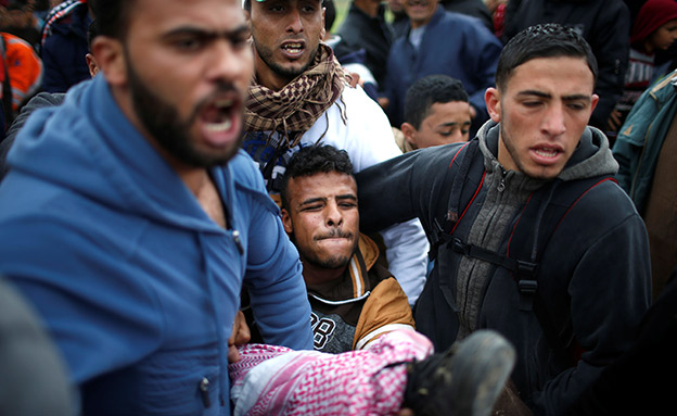 פצוע פלסטיני (צילום: רויטרס)