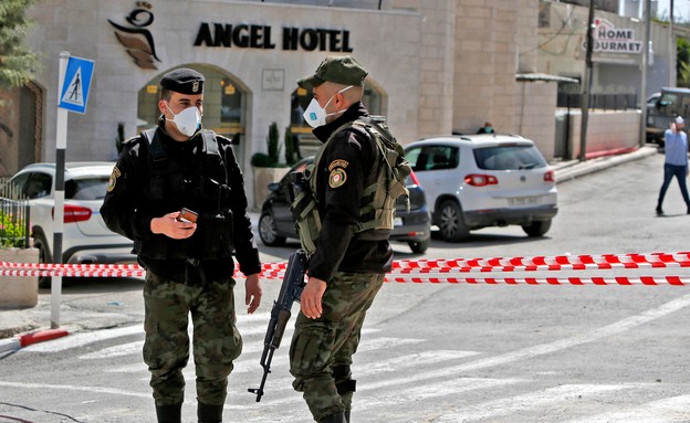 קורונה בבית ג'אלא (עיבוד: MUSA AL SHAER, AFP)