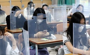 תלמידי בית ספר בדרום קוריאה (צילום: רויטרס_)