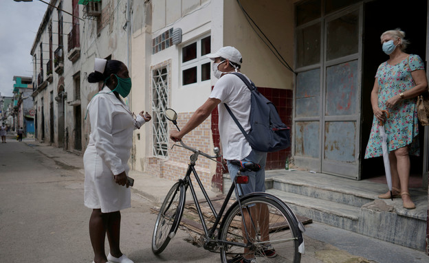 המאבק בנגיף הקורונה בקובה (צילום:  Alexandre Meneghini, רויטרס_)
