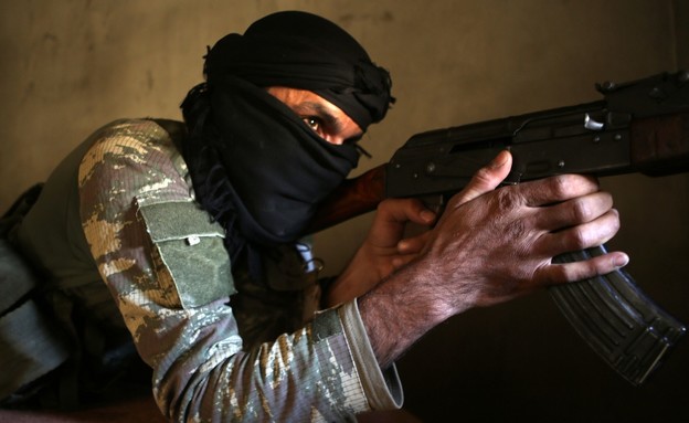 לוחם מיליציות בסוריה (צילום: BAKR ALKASEM/AFP via Getty Images)