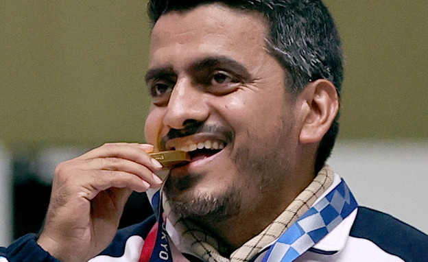 ג'וואד פורוגי מאיראן, עם המדליה (צילום: רויטרס)