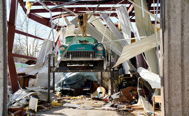 A car left hanging in the garage after the tornado hit Mayfield, Kentucky (Photo: Reuters)