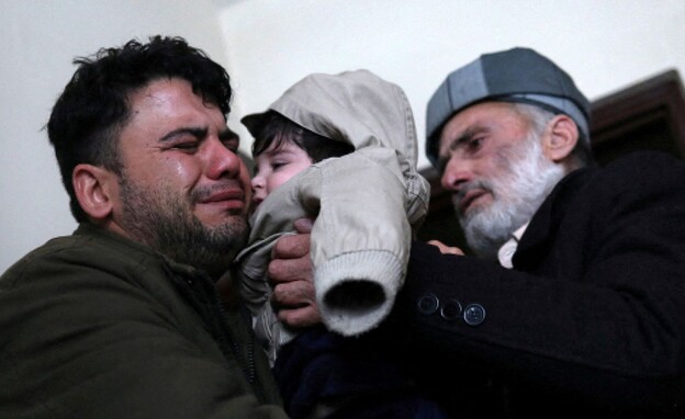 Five months after he disappeared: The Afghan baby reunited with his family
