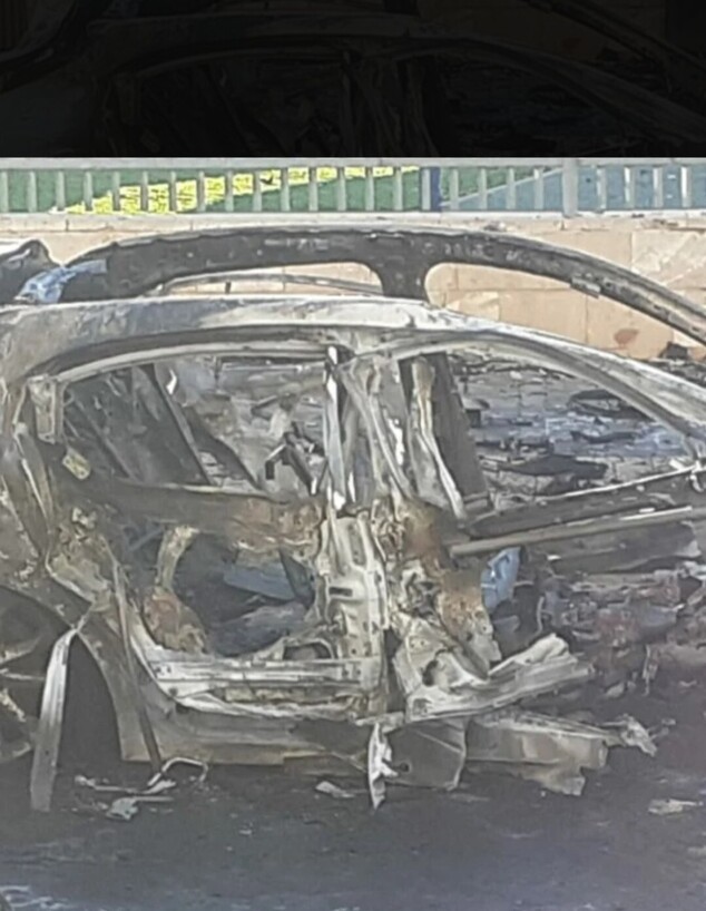 שרידי המכונית שהתפוצצה בשכונה