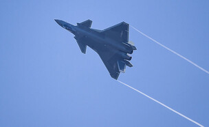 המטוס באוויר (צילום: STR/AFP/GettyImages)