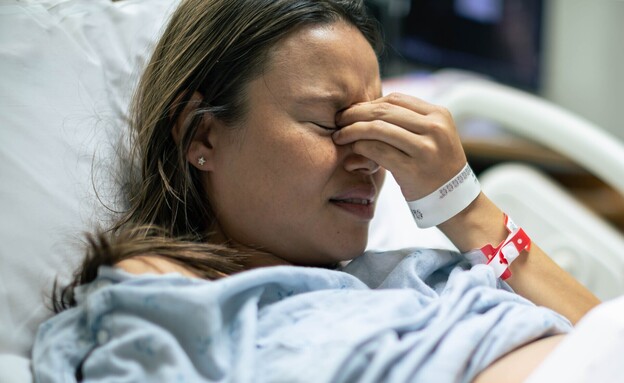 אישה במיטת בית החולים (אילוסטרציה: shutterstock)