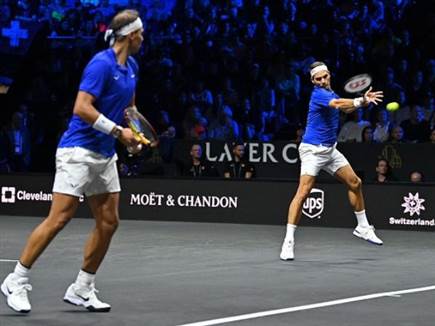 נדאל ופדרר במשחקו האחרון של השווייצרי (GLYN KIRK/AFP via Getty Ima (צילום: ספורט 5)