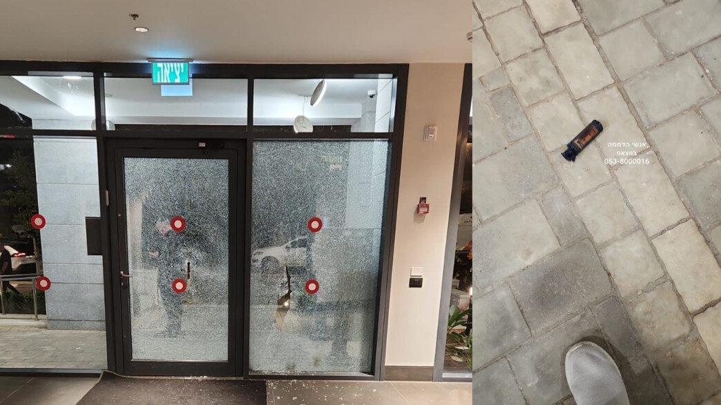 הרימון הלם ודלת הבניין שנשברה באור יהודה (צילום: אנשי הדממה/משטרת ישראל)
