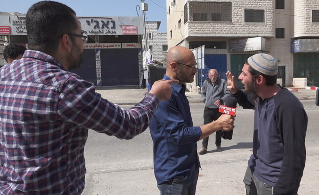 עימות סוער בכפר חווארה בין יהודי לפלסטיני (צילום: חדשות 12)