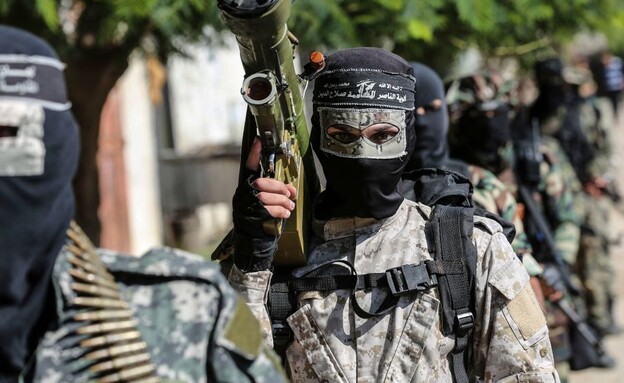 מחבל הארגון (צילום: MAHMUD HAMS/AFP via Getty Images)