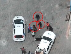 מחבלים לצד רכבי או"ם - במתחם של הארגון אונר"א  (צילום: דובר צה"ל)