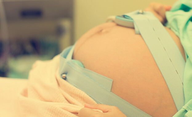 אישה בחדר לידה, אילוסטרציה. (צילום: Shutterstock)
