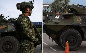 משוריינים וכוחות בגבול (צילום: Raul ARBOLEDA / AFP via Getty Images)