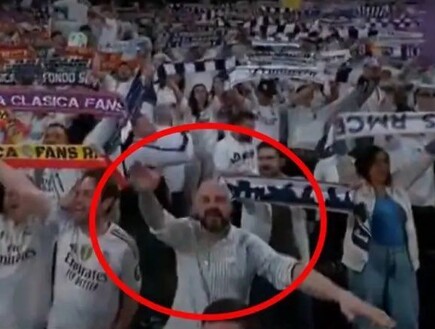 אוהד ריאל מדריד מצדיע במועל יד (צילום: אינסטגרם)