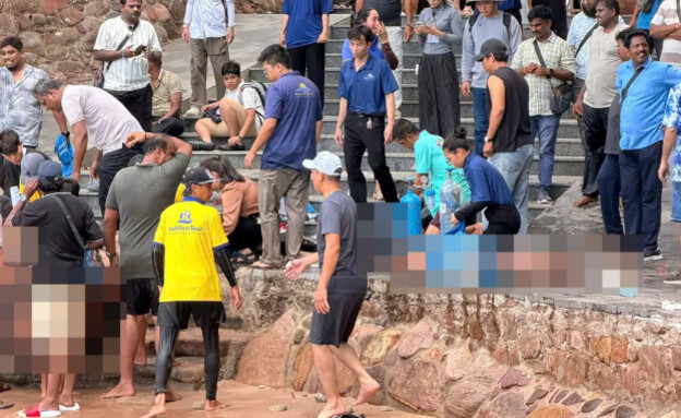 עוברי אורח מסייעים בפעולות החילוץ בוייטנאם עוברי אורח מסייעים בפעולות החילוץ בוייטנאם